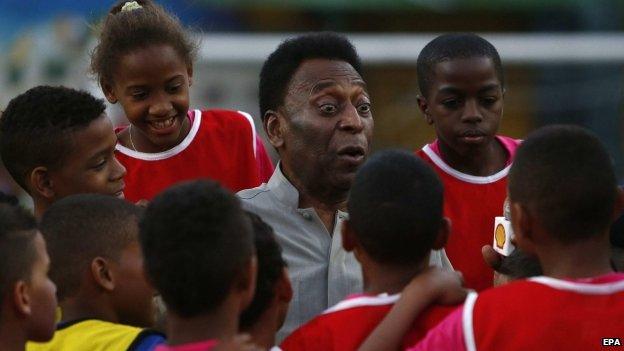 Pele with young footballers