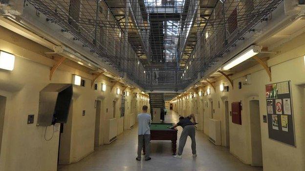 Inmates playing pool in a cell block at Wormwood Scrubs prison