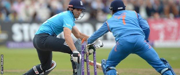 Alastair Cook is stumped by Mahendra Dhoni