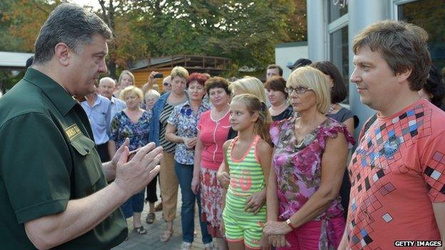 Ukrainian President Petro Poroshenko speaking with members of the community during his visit to the port city Mariupol