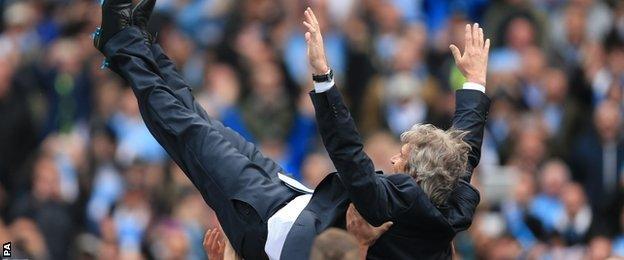 Manuel Pellegrini celebrates winning the Premier League