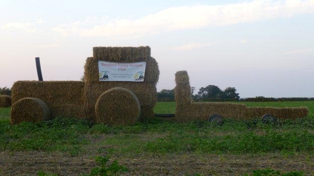 A tractor made out of hay bales