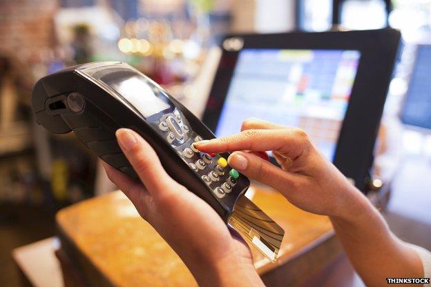 Woman holding card machine