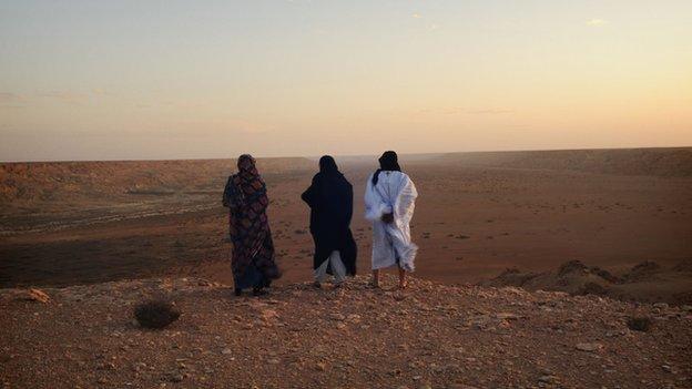 Three Sahrawi women in the Sahara desert