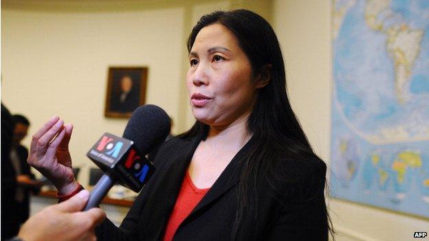 Zhang Qing, the wife of Chinese human rights activist Yang Maodong, also known as Guo Feixiong, speaks to journalists before a hearing of a House Foreign Affairs Committee subcommittee in Washington, DC, on 29 October 2013