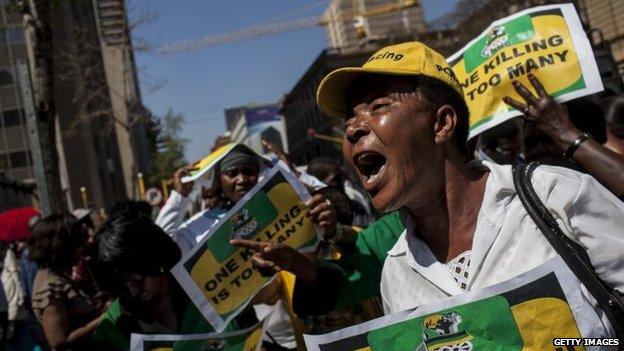 Members of the ANC Women's League protest outside the North Gauteng High Court in Pretoria, South Africa, 11 September 2014