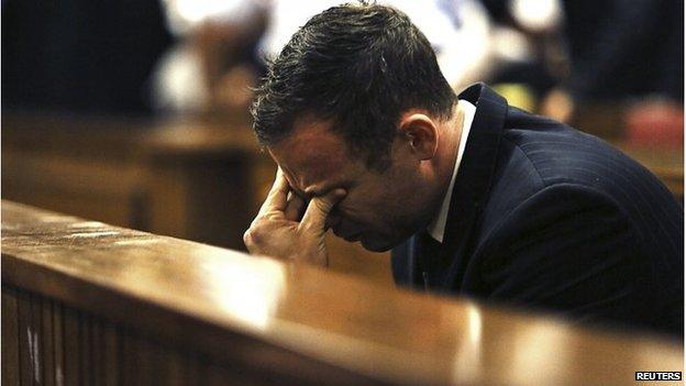 Oscar Pistorius reacts as Judge Thokozile Masipa delivers her verdict at the North Gauteng High Court in Pretoria on 12 September.