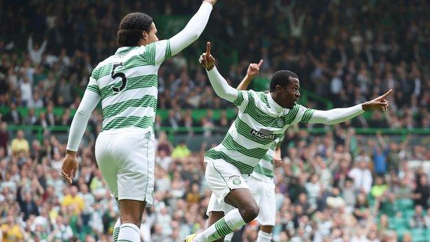 Celtic defender Efe Ambrose (right) and Jason Denayer celebrate the opening goal.