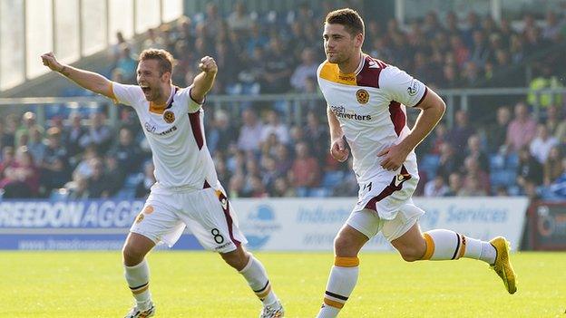 Motherwell star Iain Vigurs wheels away to celebrate his opener against Ross County.