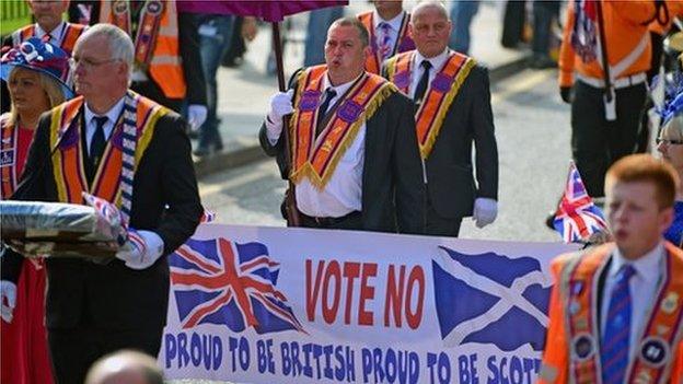 Orangemen and women march during a pro union parade in Edinburgh