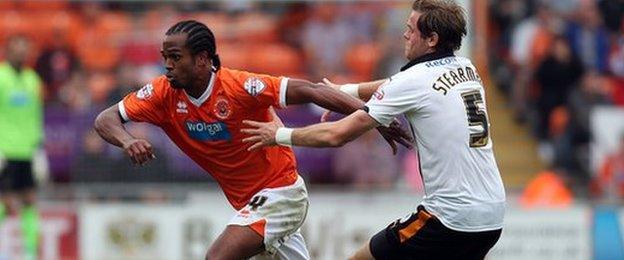 Blackpool-Wolves, Bloomfield Road, 13 September 2014. Nathan Delfouneso evades the attentions of Richard Stearman