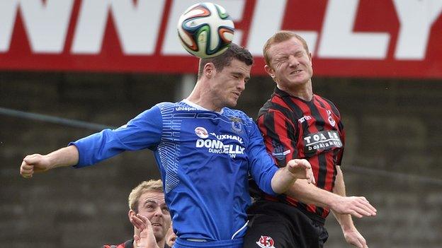 Gary Liggett battles with Crusaders defender Davy Magowan