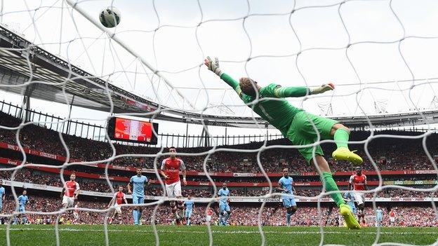 Alex Sanchez puts Arsenal ahead as he fires past Manchester City keeper Joe Hart