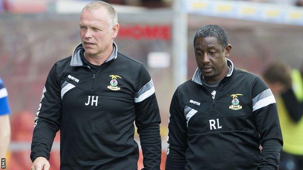 Inverness manager John Hughes and his assistant Russell Latapy