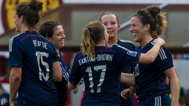 Leanne Crichton (right) is hailed by her team-mates after making it 7-0 to Scotland