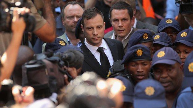 Oscar Pistorius leaves on bail from the North Gauteng High Court on 12 September 2014 in Pretoria, South Africa.