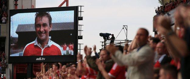 Former Forest and Derby manager Brian Clough is shown on the screen at the City Ground