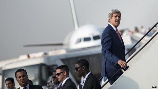 US Secretary of State John Kerry boards his plane at Cairo International Airport on 13 September 2014 as he leaves the Egyptian capital.