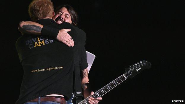 Prince Harry hugging Dave Grohl