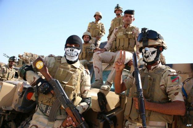 Iraqi soldiers pose for a photograph during a military training exercise in Basra before being deployed to the north of Iraq - 14 September 2014