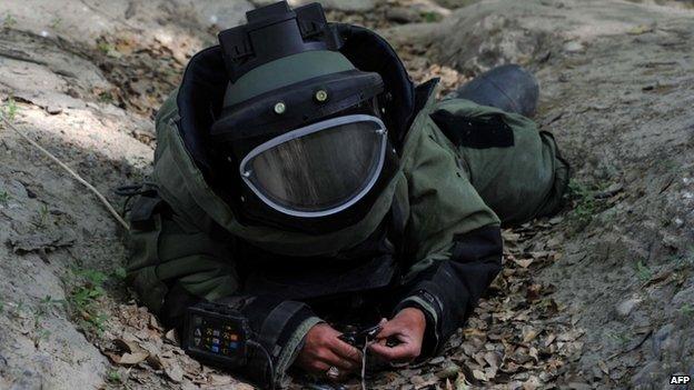 Afghan National Army soldier participates in an IED defusing training exercise in Jalalabad, Nangarhar province