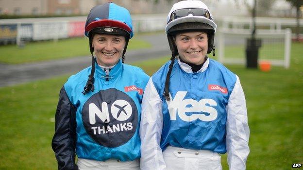 Jockey Carol Batley, representing the "No" vote, (L) and jockey Rachael Grant, representing the "Yes" vote, prepare to take part in a "Referendum Race" sponsored by Ladbrokes at Musselburgh racecourse on September 15, 2014