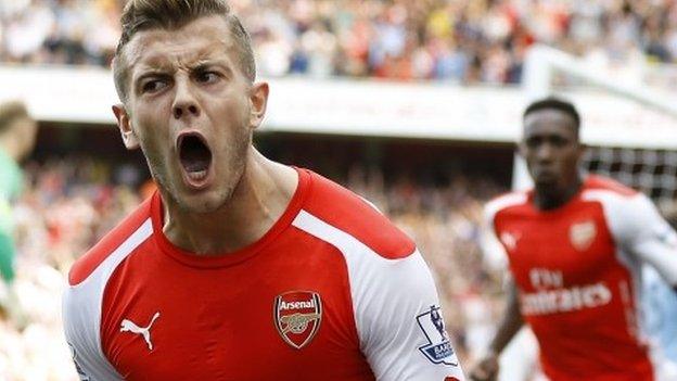 Jack Wilshere (left) celebrates scoring for Arsenal