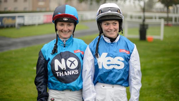 Jockeys Carol Batley and Rachael Grant, prepare to take part in a 'Referendum Race' at Musselburgh racecourse in Edinburgh, Scotland, on September 15, 2014