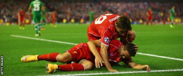 Fabio Borini congratulates Javi Manquillo after he is fouled for Liverpool's late penalty