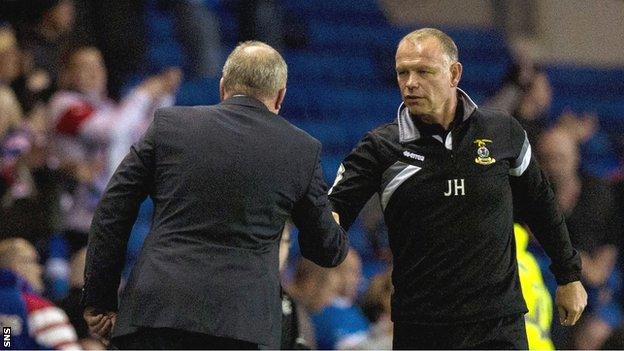 Inverness CT manager John Hughes shakes hands with Rangers boss Ally McCoist