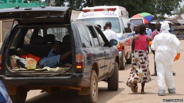 Two people sick with the Ebola virus arriving at a hospital in Monrovia, Liberia