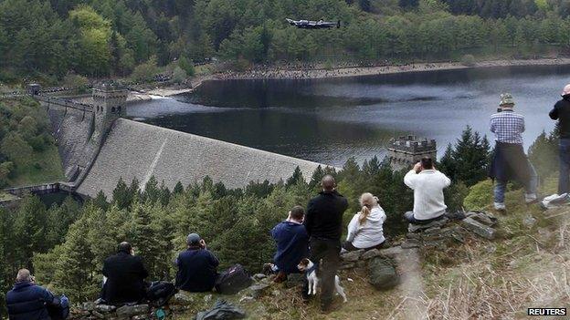 Photographers on dam bank