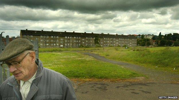 Man outside flats in Glasgow