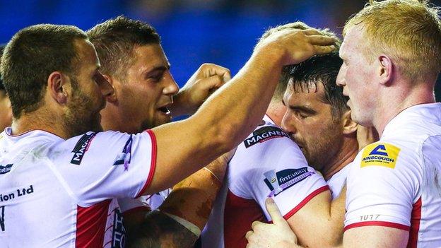 Wigan Warriors players celebrate Matty Smith's try