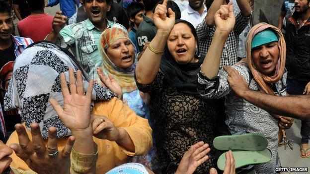 Kashmiri supporters chant slogans during a protest march against Indian rule in India-controlled Kashmir in Srinagar on 23 June 2014