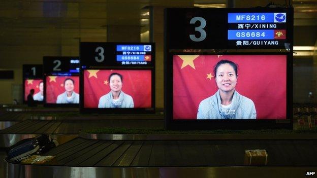 An image of Chinese tennis star Li Na seen on a promotional video for the upcoming Wuhan Open tennis tournament, at the airport in Wuhan, in China's Hubei province on 19 September 2014