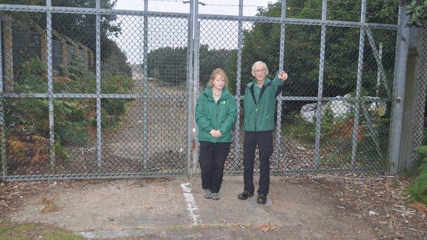 Olivia English and Nigel Turner outside RAF Woodbridge's East Gate