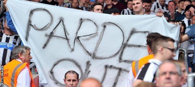 Newcastle fans at St Mary's hold up a banner calling for Pardew to be sacked