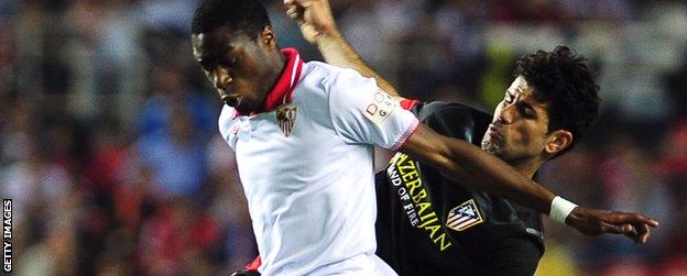 Diego Costa (right) tussles with Sevilla's Geoffrey Kondogbia