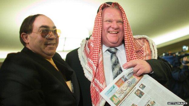 Rob Ford in a keffiyeh with a supporter