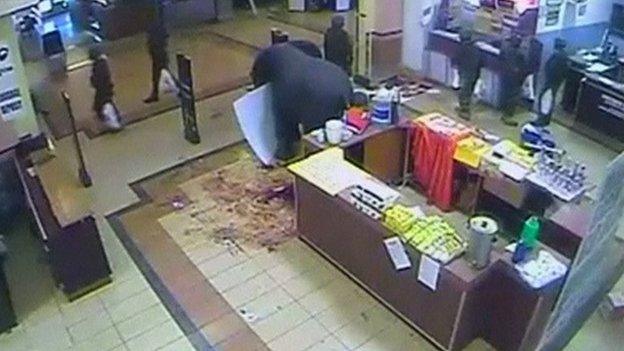 CCTV footage of Kenyan soldiers carrying plastic bags as they leave a supermarket in the Westgate shopping centre