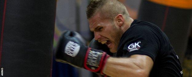 Christopher Rebrasse hits a punchbag in a workout before facing Groves