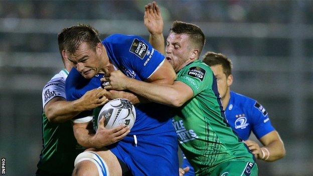 Leinster's Rhys Ruddock is held by Connacht duo Dave Heffernan and Jack Carty