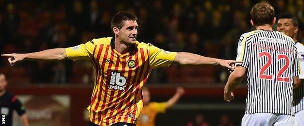 Partick Thistle striker Kris Doolan wheels away in celebration