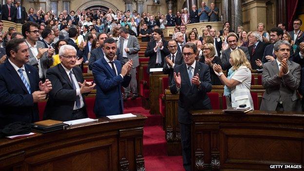 President of Catalonia Artur Mas (3rdR) celebrates after the Catalan Parliament approved the Law allowing Catalonia"s Government to call on a self-determination referendum from Spain on September 19, 2014 in Barcelona, Spain