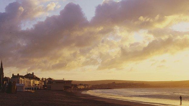 Weymouth beach at sunrise by Richard Fisher