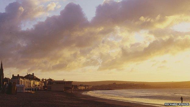 Weymouth beach at sunrise by Richard Fisher