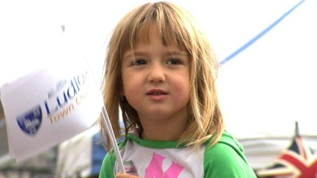 Girl waving flag