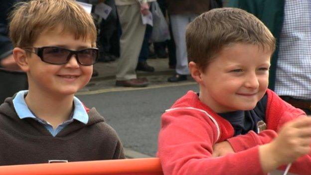 Boys waving flags