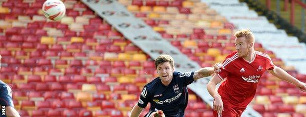 Adam Rooney nets the opener for Aberdeen